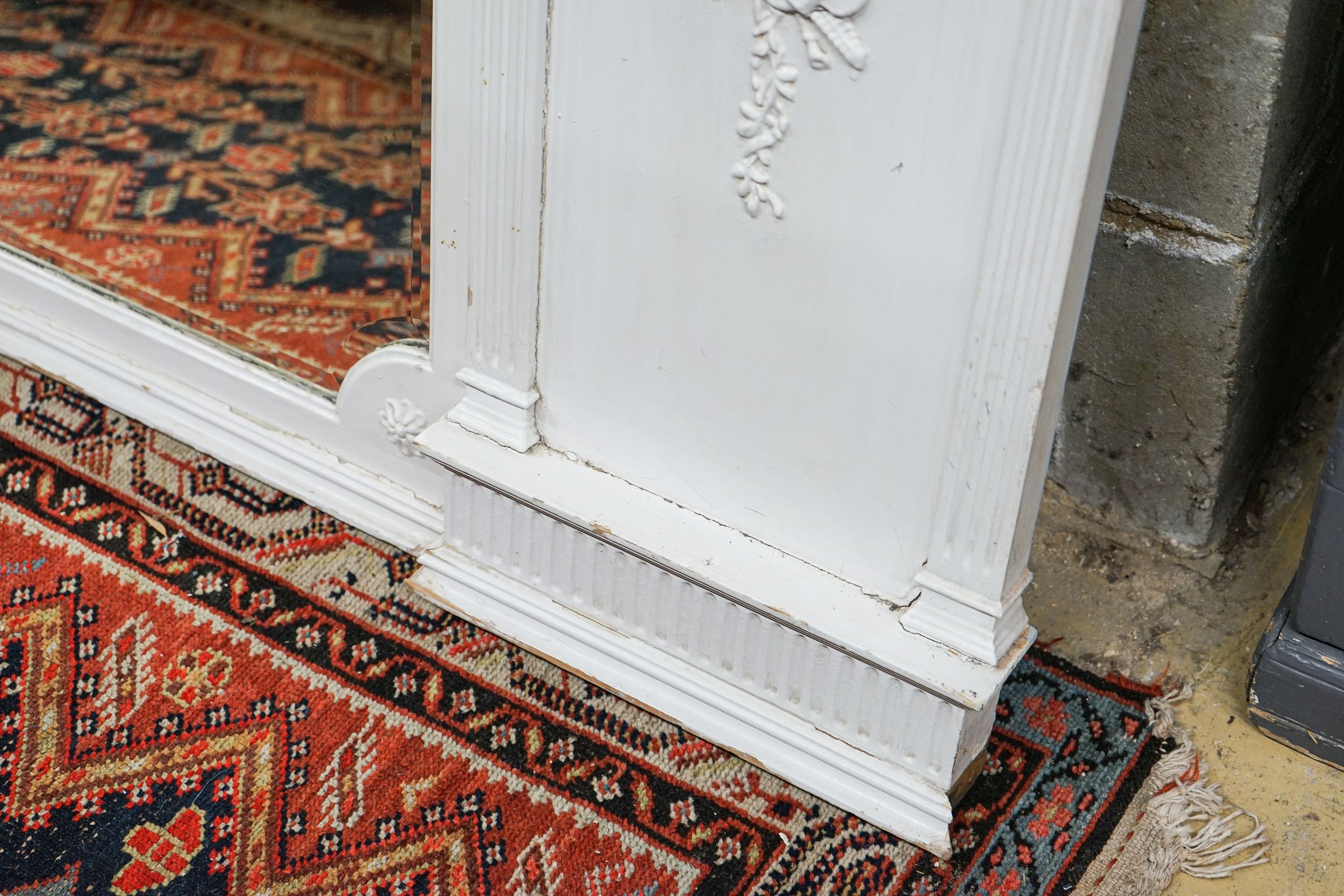 A Victorian later painted overmantel mirror, width 143cm, height 76cm together with a painted and mirrored overmantel